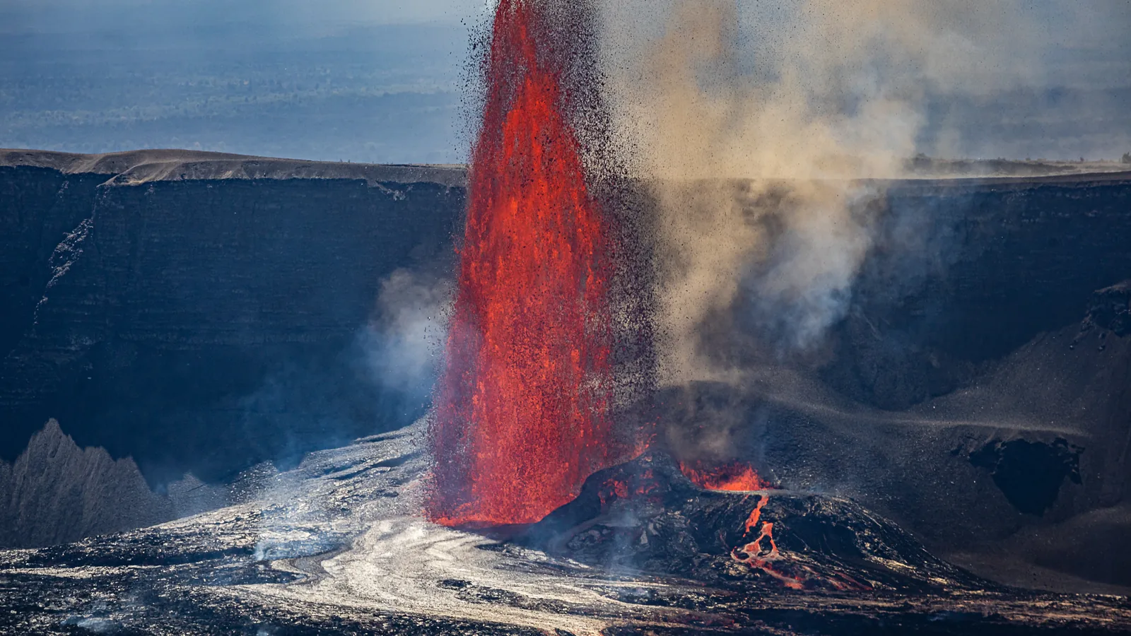 A lava fountain erupting from a vent inside Hawaii Volcanoes National Park during an active phase