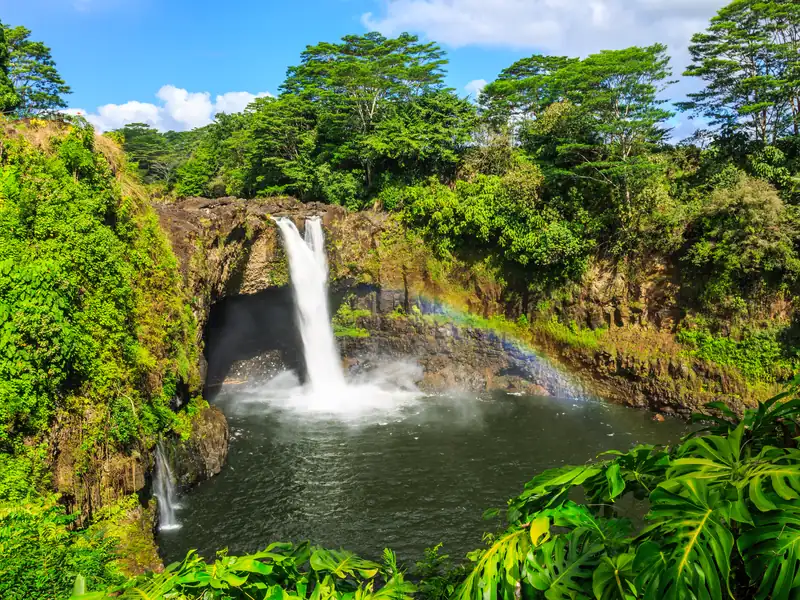 Rainbow Falls in Hilo with a rainbow in the spray below the waterfall
